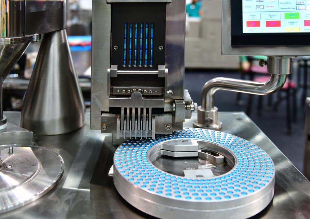 Capsule shells being filled on an automatic encapsulation machine