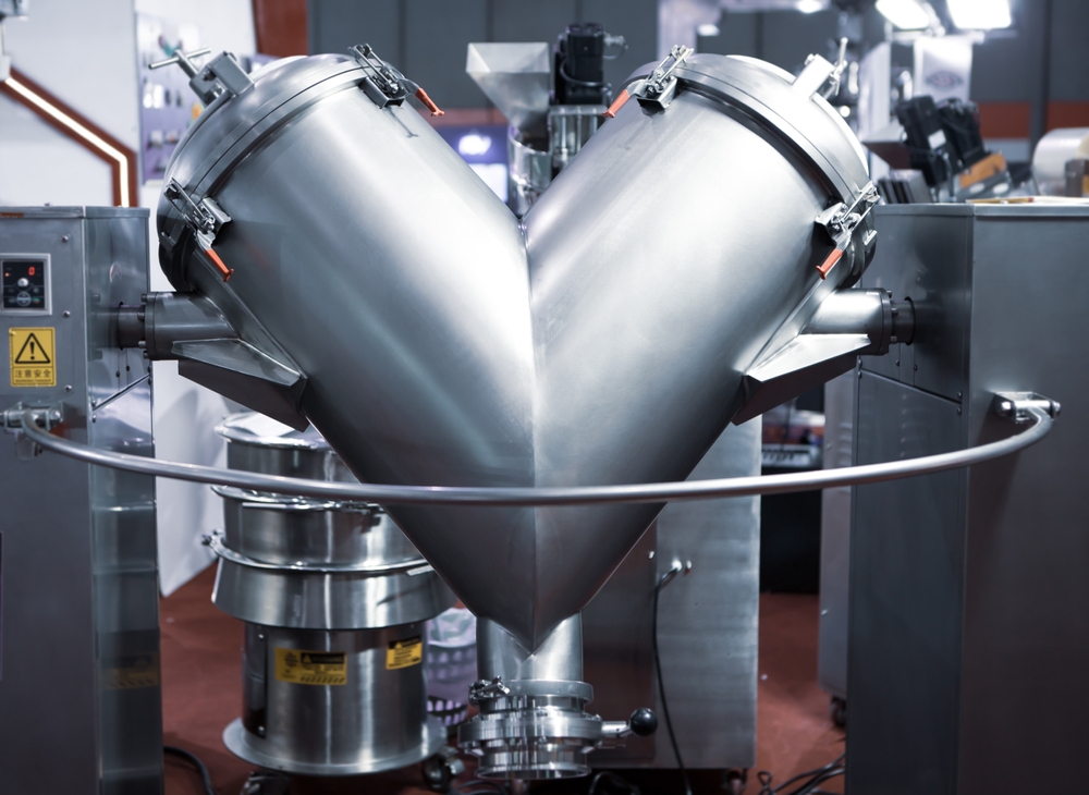 Industrial V-blender machine used to blend powder supplement formulas