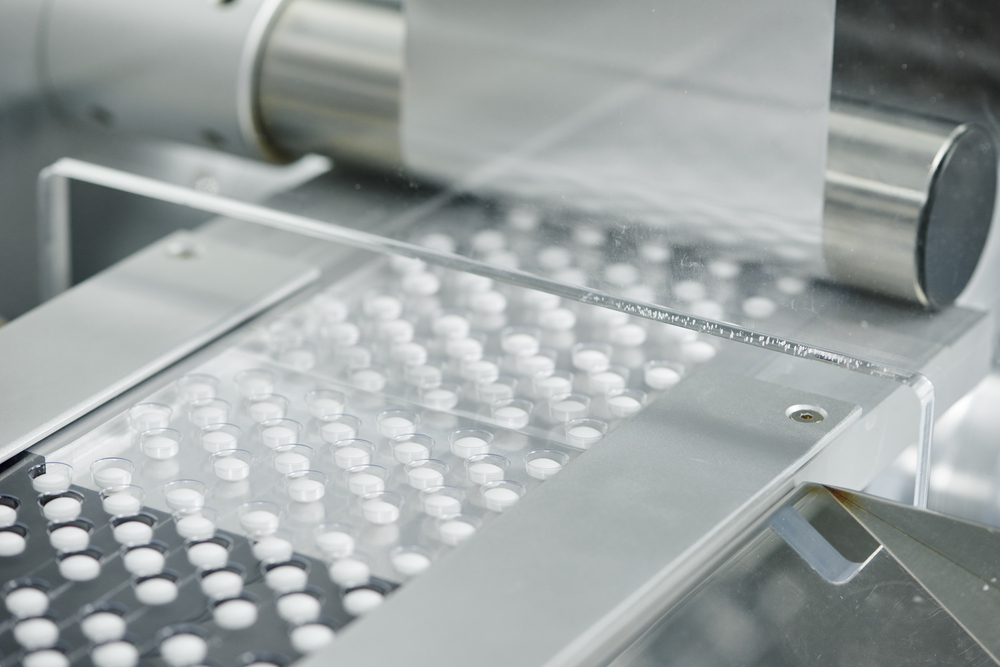 Tablets moving through the tablet manufacturing process